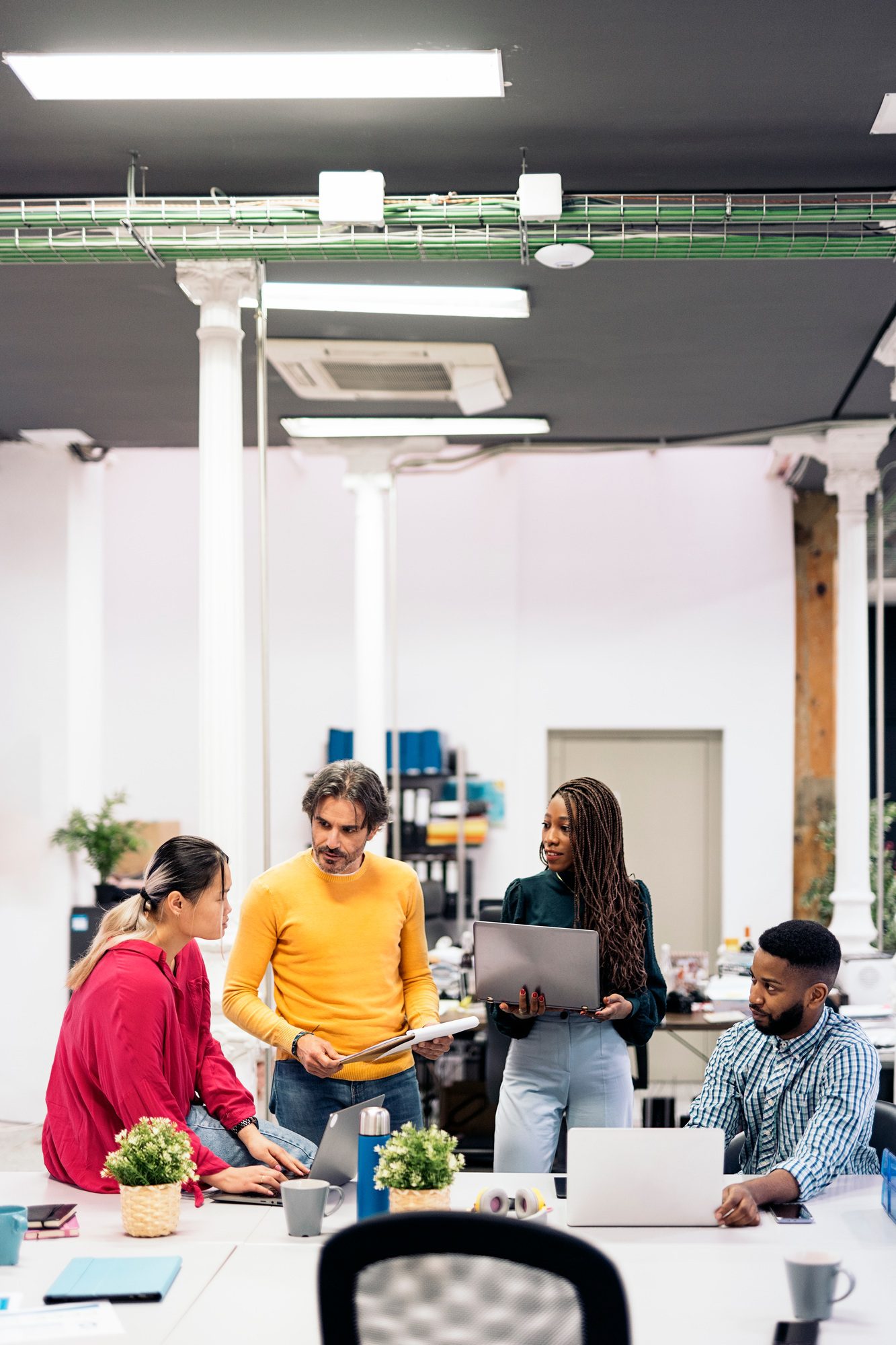 Diverse Work Team Working in the Office Diverse Work Team Working in the Office